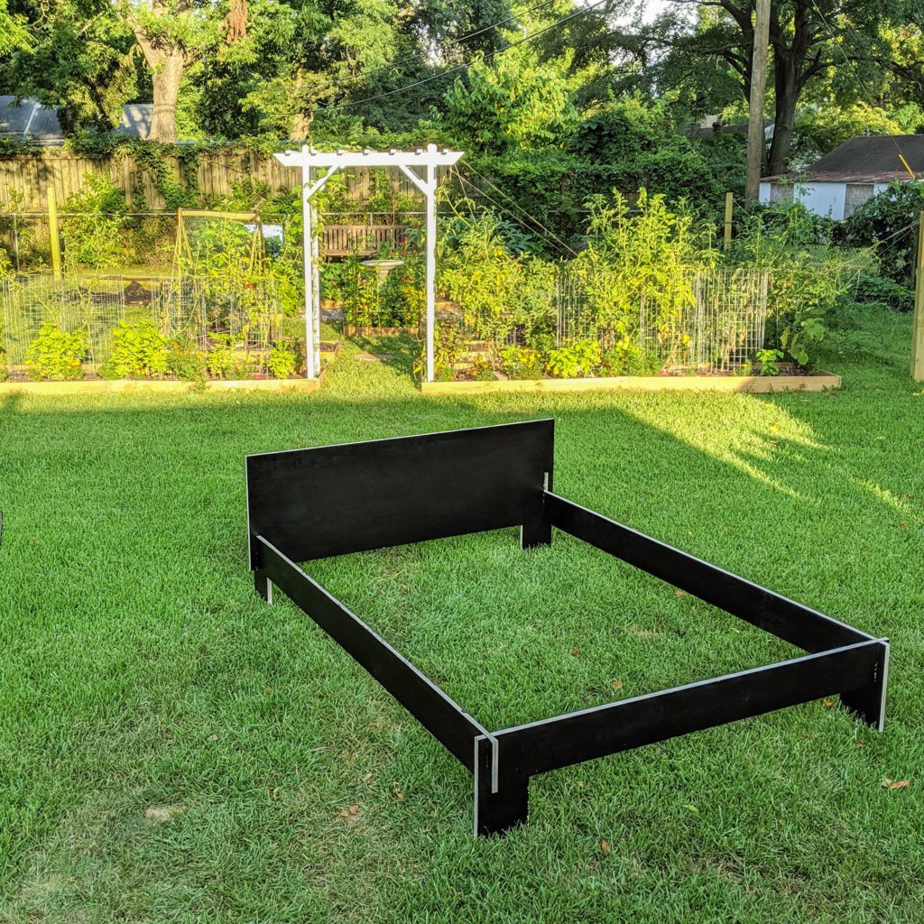 bed frame in the back yard